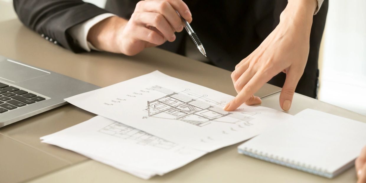 Professional reviewing architectural blueprints